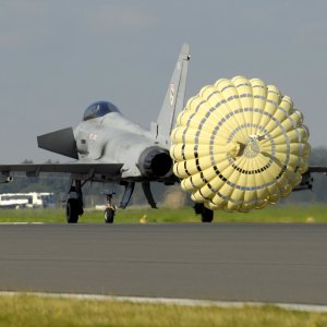 A_Typhoon_F2_fighter_jet_deploys_a_brake_parachute_as_it_lands_at_RAF_Coningsby_MOD_45147966.jpg