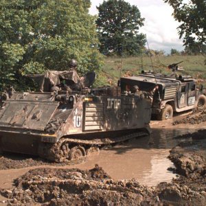 M113 Preparing to pull an armored Humvee out