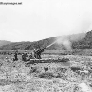 Korean War, A 105-mm howitzer in action