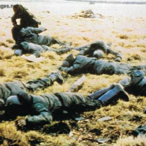 Argentine prisoners lie on the ground