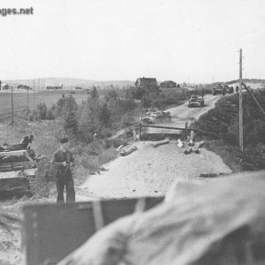 German tanks mastering a blown-up bridge