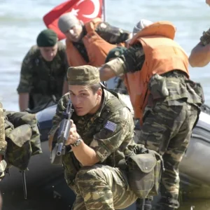 Greek Marine guards the beach