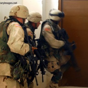 Team of Soldiers prepares to forcibly enter a room