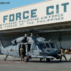 Airmen board an HH-60 Pave Hawk helicopter