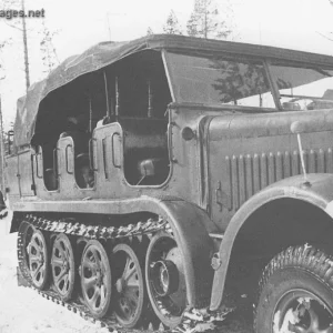 Sd.Kfz 7 tows a field howitzer using the winch