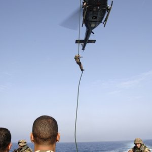Italian Marine rappels from a AB-212 helicopter