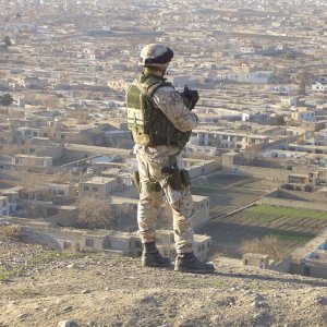 Italian soldier of ISAF on patrol surveys Kabul
