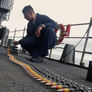 Seaman helps unload ammunition