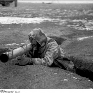 Soldier with gas mask in trench with Panzerschreck