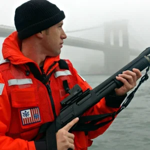 A US Coast Guard MSST Member with a Remington M870 Shotgun