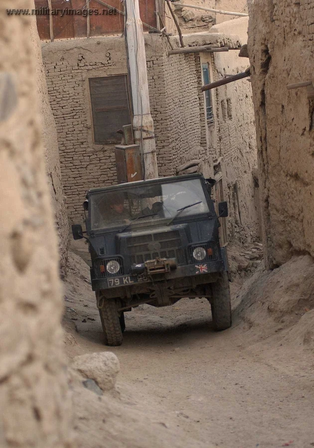 An ISAF vehicle negotiates the narrow streets of Kabul