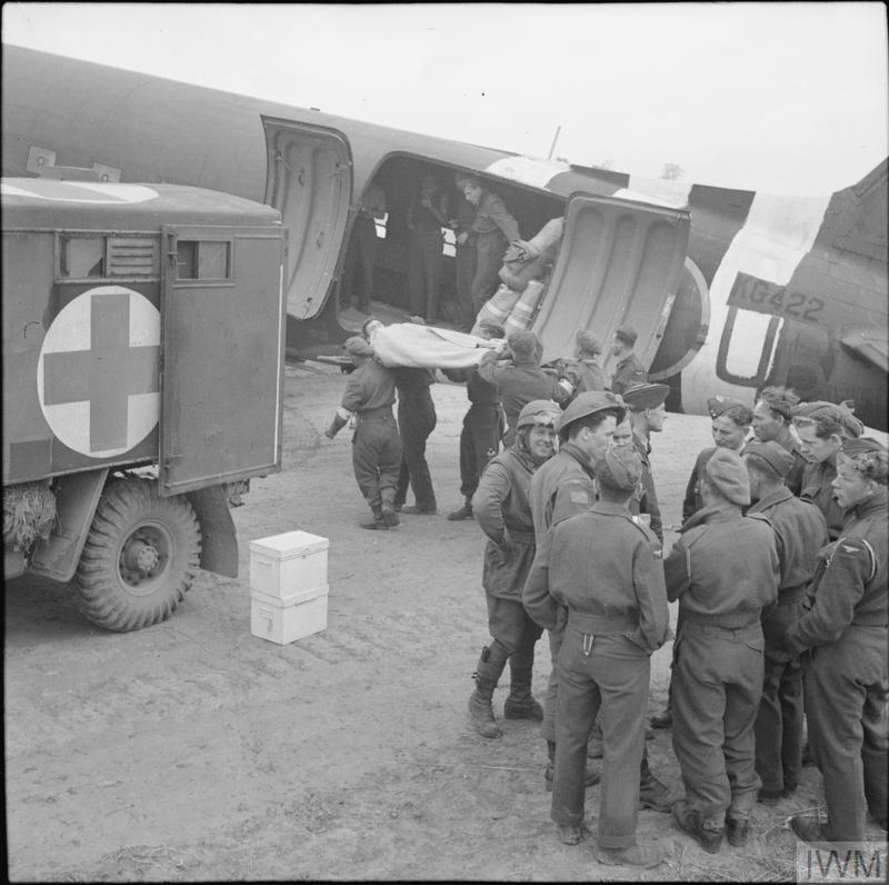Casuality being loaded into a Dakota.