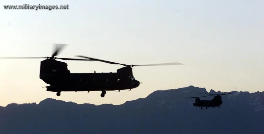 CH-47 Chinook helicopters take off in the early morning