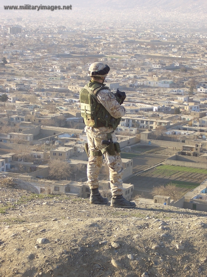 Italian soldier of ISAF on patrol surveys Kabul