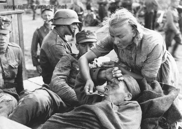 "Lotta" giving something to drink for a wounded