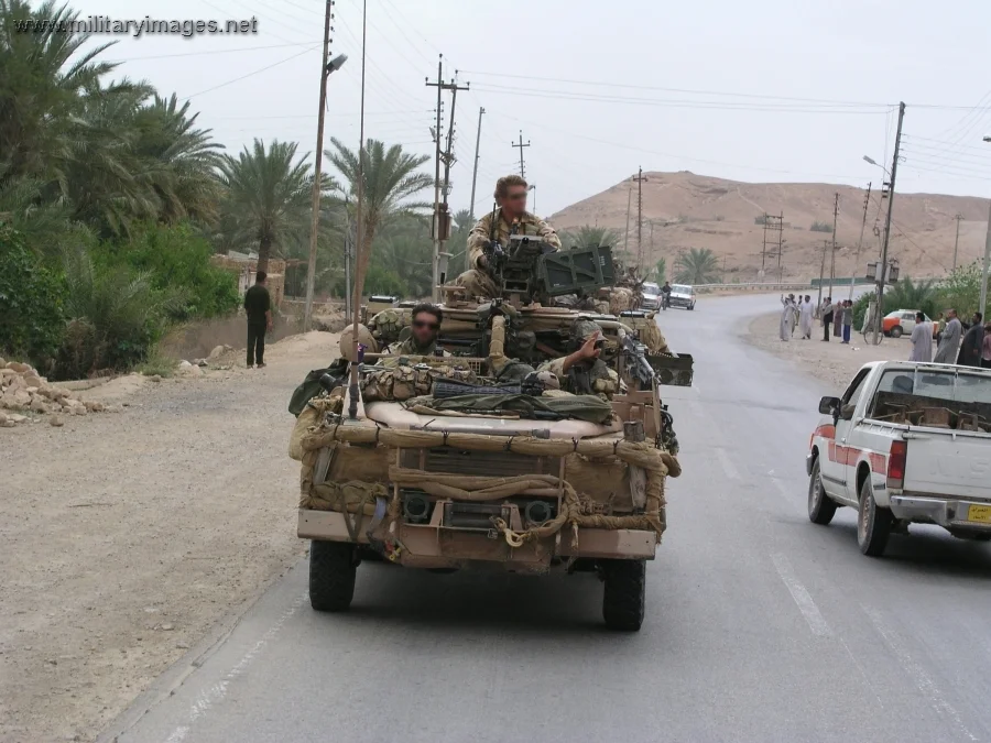 SAS patrol moves down a main road