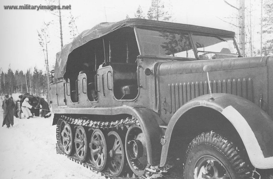 Sd.Kfz 7 tows a field howitzer using the winch