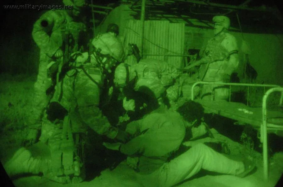 U.S. Army soldiers detain two suspects