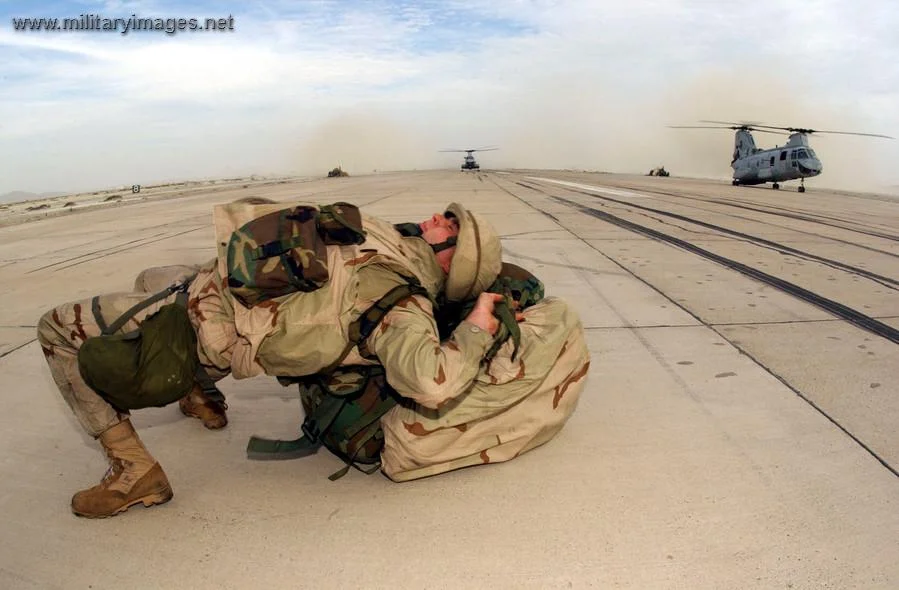 U.S. Marine straps on a backpack A Military Photos Video Website
