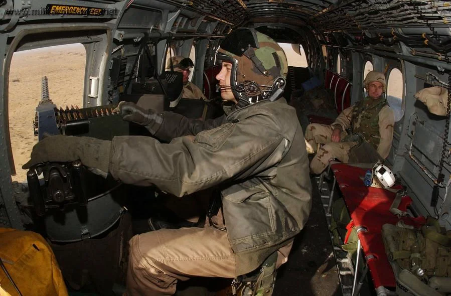 U.S. Marines go on a mission in a CH-46E Sea Knight