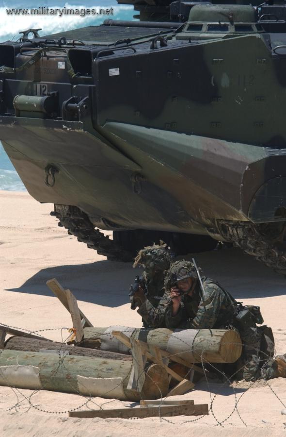 U.S. Marines guard their Amphibious Assault Vehicle